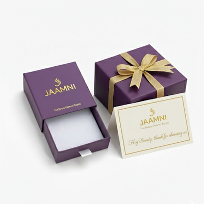 Purple gift box with gold bow and 'Jaamni' branding on a white background