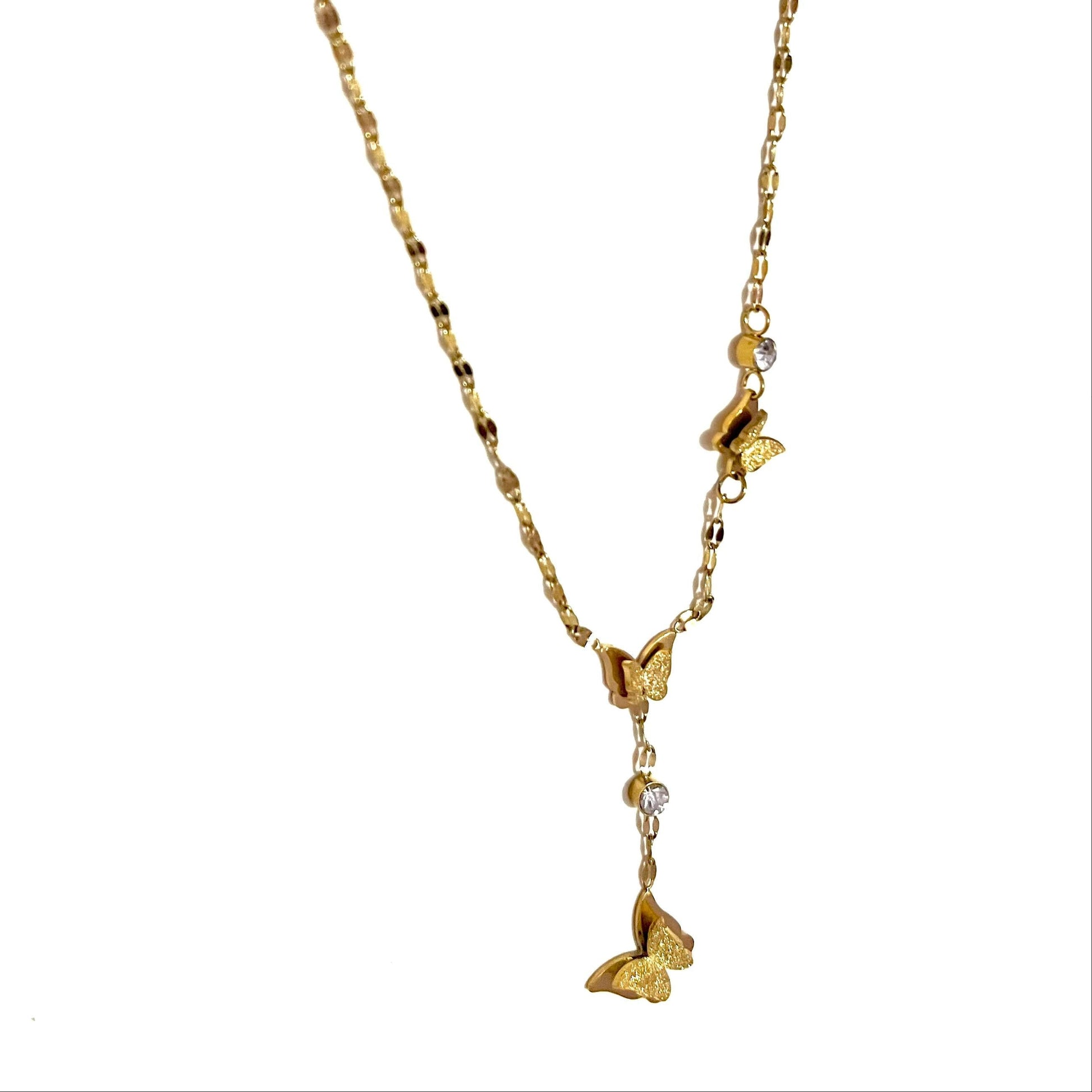 Gold  antiternish necklace with butterfly pendants on a white background