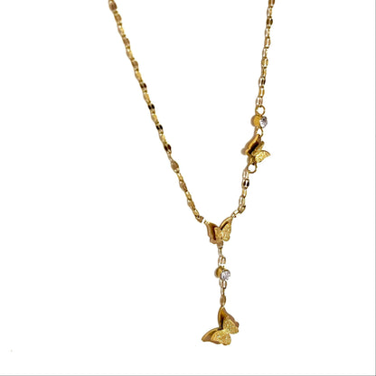 Gold  antiternish necklace with butterfly pendants on a white background
